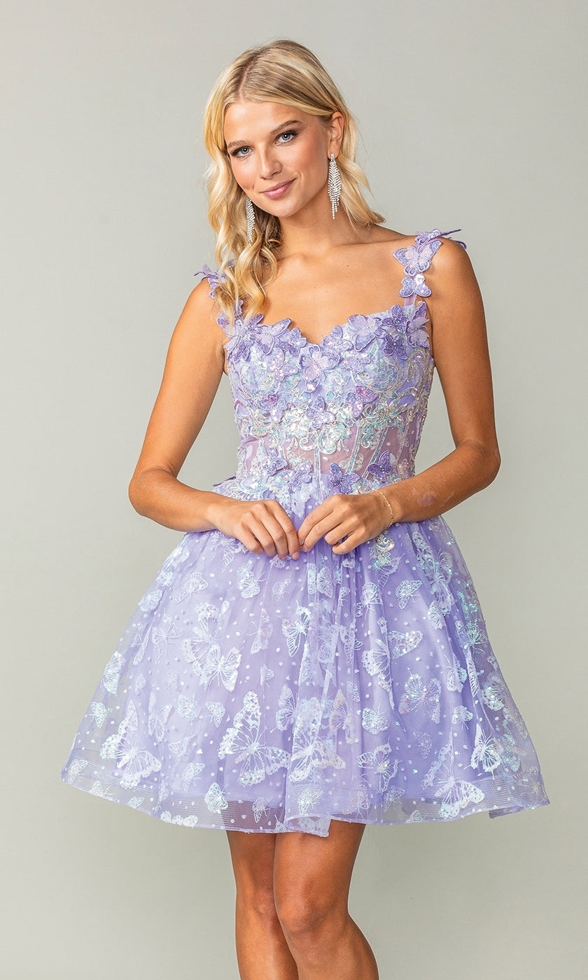 A woman wears the Sparkly Short Butterfly Homecoming Dress 3361, an affordable light purple, sleeveless short dress with floral patterns, standing against a plain light gray background.